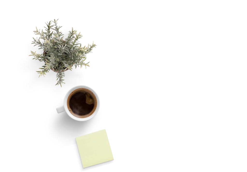 Plant, coffee, and post-it over a white background