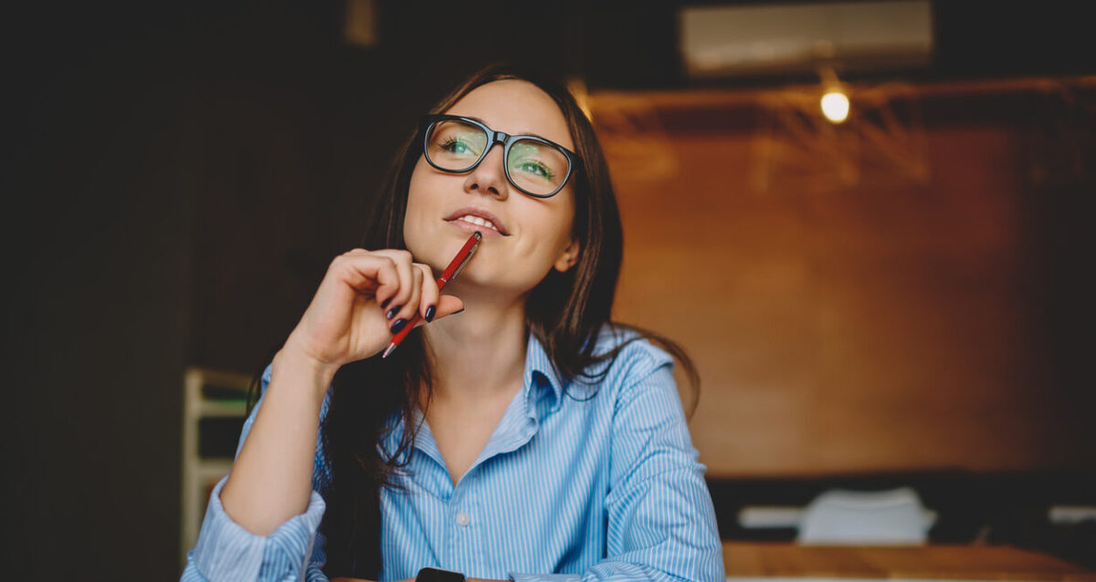 A woman thinking of customer winback strategies.