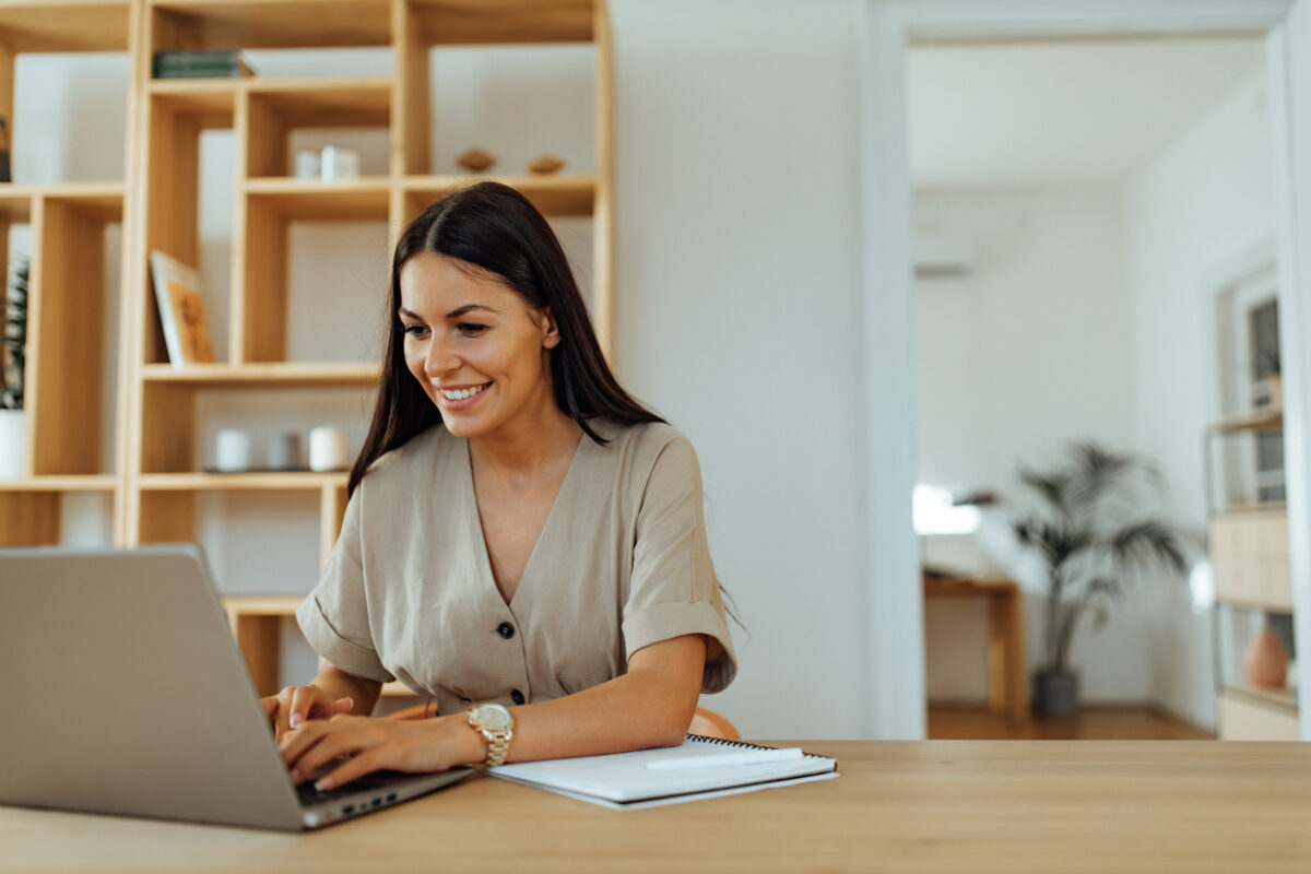 Woman writing a cold email marketing campaign