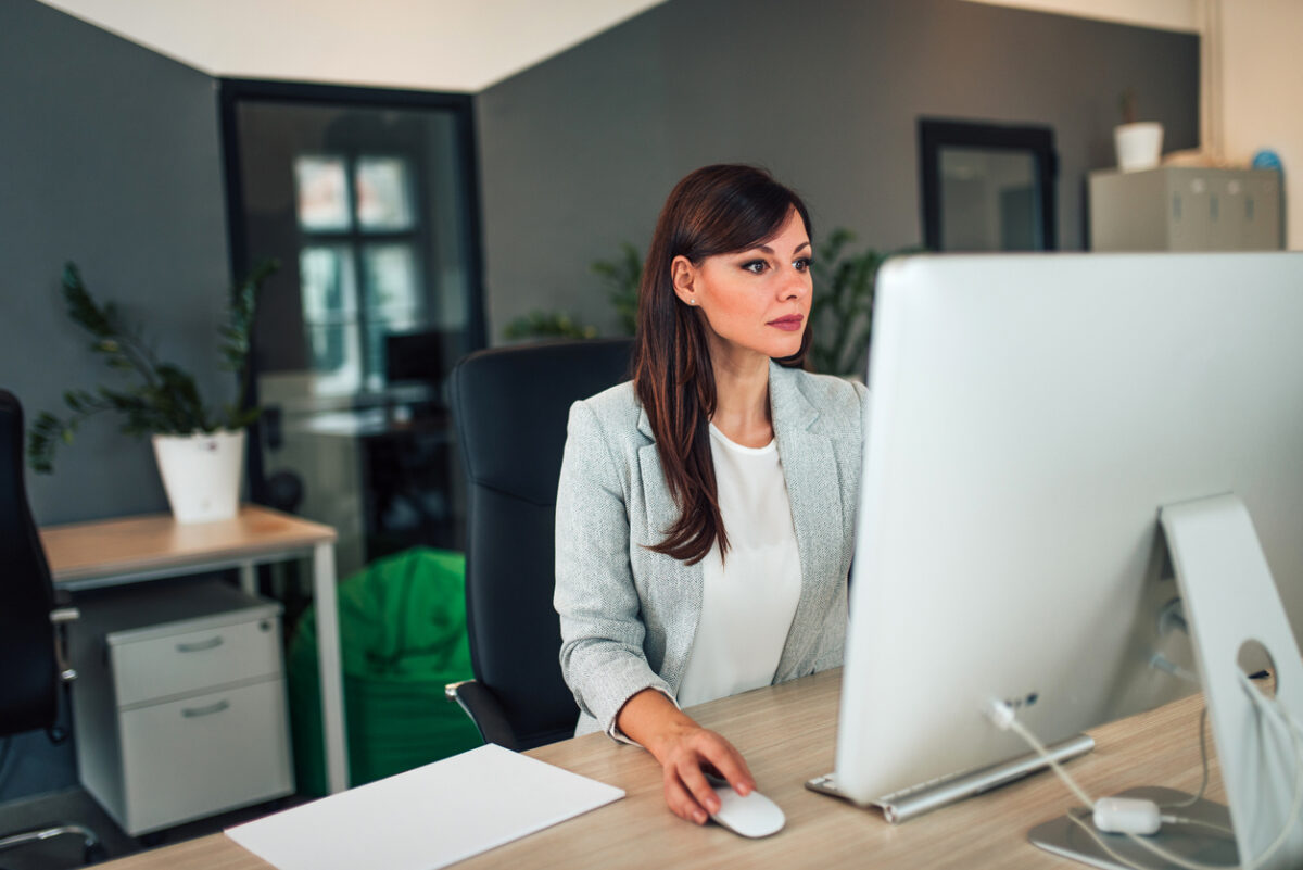 Woman setting up Salesforce email campaigns.