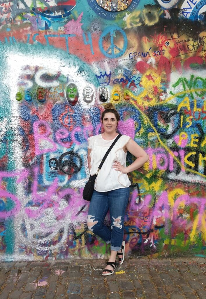 Janna Hagan with with graffiti on the background.